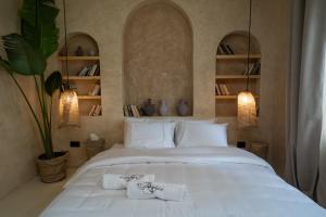 A bed or beds in a room at Biophilia Luxury Lofts