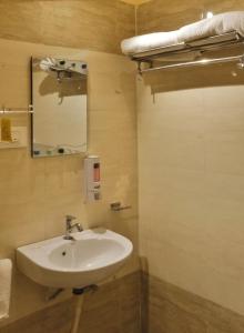 a bathroom with a sink and a mirror at Bodhi Retreat in Pushkar +8 photos