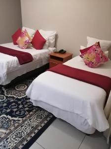 Ένα ή περισσότερα κρεβάτια σε δωμάτιο στο Royal guest house