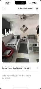 a living room with two beds and a couch at Alexandra Palace White Hart Lane Twin room in London