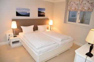 En eller flere senge i et værelse på Residenz Wenningstedt