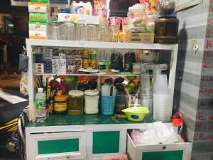 a shelf filled with lots of food and other items at TUYẾT NA Homestay in Phan Thiet