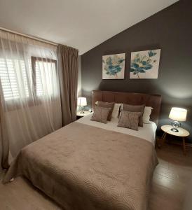 Postel nebo postele na pokoji v ubytování Apartaments Victoria