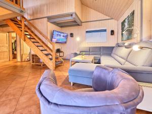 a living room with a couch and a table at Wildgans Classic 248 in Mirow