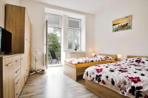 Posteľ alebo postele v izbe v ubytovaní Apartmány Děčín