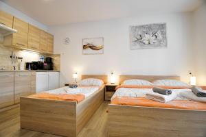 Posteľ alebo postele v izbe v ubytovaní Apartmány Děčín