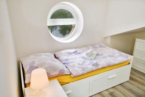Posteľ alebo postele v izbe v ubytovaní Apartmány Děčín