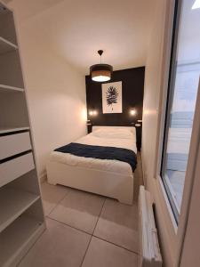 Ένα ή περισσότερα κρεβάτια σε δωμάτιο στο Au coin des Thermes - Draps en option +52 φωτογραφίες