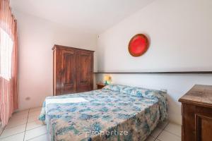 Ένα ή περισσότερα κρεβάτια σε δωμάτιο στο Casa degli Oleandri by Propertize