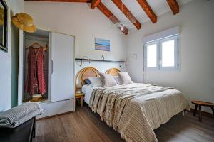 Voodi või voodid majutusasutuse Ocean Vibes Montalivet B&B toas