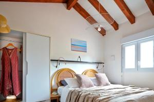 Voodi või voodid majutusasutuse Ocean Vibes Montalivet B&B toas
