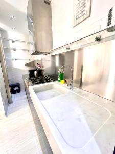 a kitchen with a sink and a stove at 15 - Tourist House Bologna Primaticcio - Self check-in in Bologna +97 photos