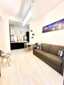 a living room with a couch and a table at 15 - Tourist House Bologna Primaticcio - Self check-in in Bologna