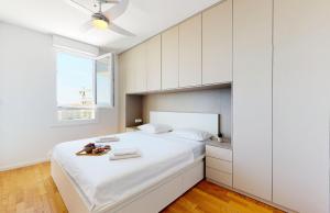 Un pat sau paturi într-o cameră la Apartment Baby Blue
