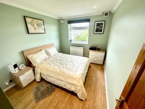 מיטה או מיטות בחדר ב-Heart of Windsor