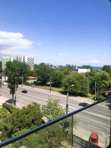 a view of a city street from a balcony at Mamaia SUNNY LOFT in Mamaia
