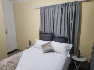 Ένα ή περισσότερα κρεβάτια σε δωμάτιο στο #29 Apartments