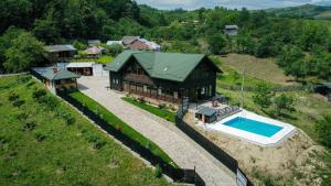 an aerial view of a house with a swimming pool at Pensiunea Roxana in Buzău