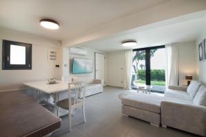 a living room with a couch and a table at Maya Luxury Suite in Aegenitissa