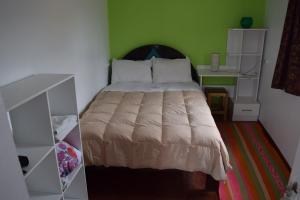 Uma cama ou camas num quarto em Barrio Inka B&B