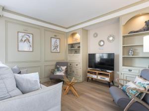 TV a/nebo společenská místnost v ubytování Sitges Spaces Seaside Paradise