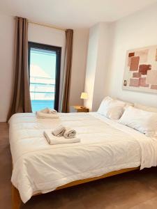 Postel nebo postele na pokoji v ubytování Marisabella Suite 7