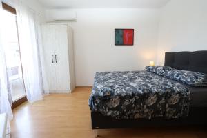 Postel nebo postele na pokoji v ubytování Apartmani Ivan Pula