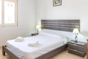 Postel nebo postele na pokoji v ubytování La Farella 60 - Apartamento con balcón