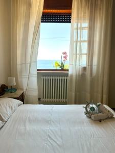 Ένα ή περισσότερα κρεβάτια σε δωμάτιο στο Villetta Claudia