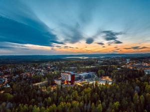 an aerial view of a building in a forest at The Well in Kolbotn