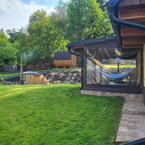 a view of a yard with a house at chata-brdy in Nové Mitrovice
