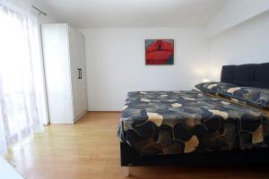 Postel nebo postele na pokoji v ubytování Apartmani Ivan Pula