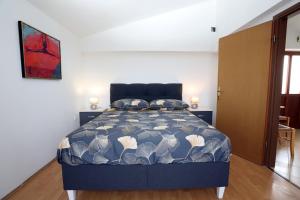 Postel nebo postele na pokoji v ubytování Apartmani Ivan Pula