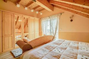 a bedroom with a large bed and a window at Haus Emanuel in Weilerbach