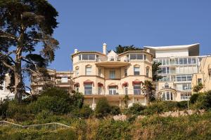 a large building on top of a hill at Bayfort Sea Studio - Comfortable Couples Retreat with Stunning Coastal Views in Torquay