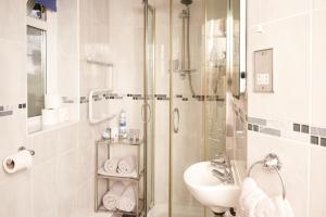 a bathroom with a shower and a sink at Bayfort Sea Studio - Comfortable Couples Retreat with Stunning Coastal Views in Torquay +22 photos