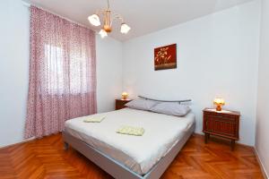 Ένα ή περισσότερα κρεβάτια σε δωμάτιο στο Apartment Anita 608