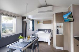 Giường trong phòng chung tại Gitavillage Argentario +154 ảnh