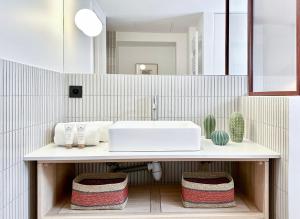 a bathroom with a sink and a counter with towels at 1570 - Luxury spot in Paris Olympic Games 2024 in Paris