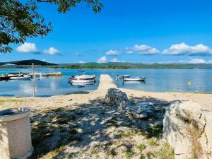 a group of boats are docked on a beach at TaJa Vortex in Turanj