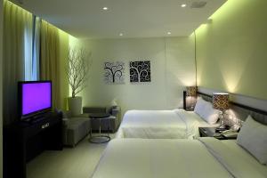 Katil atau katil-katil dalam bilik di Hsiangkelira Hotel