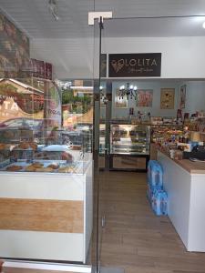 a bakery with a display case in a store at MARGARITAS' ROOMS in Agios Gordios
