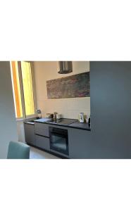 A kitchen or kitchenette at Les Artes