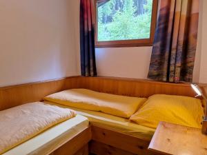 Posteľ alebo postele v izbe v ubytovaní Alpenpension Gastein