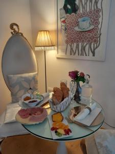 a glass table with a plate of food on it at Espaco Edla in Sintra +28 photos