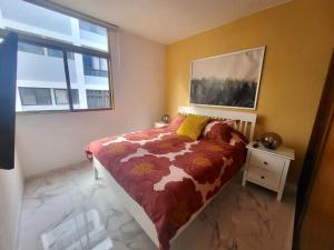 A bed or beds in a room at New big flat with balcony 50mts away from beach Parking Optional