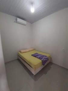 Cama ou camas em um quarto em Pousada São Jose City