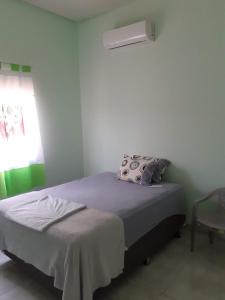 Cama ou camas em um quarto em Pousada São Jose City