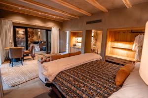 a bedroom with a large bed in a room at Kapama River Lodge in Kapama Private Game Reserve