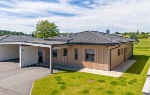 a house with a pitched roof at Villa Mit Pool In Stegersbach in Neudauberg